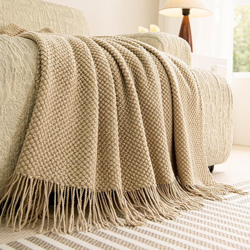 Oatmeal textured knit throw blanket with tassels