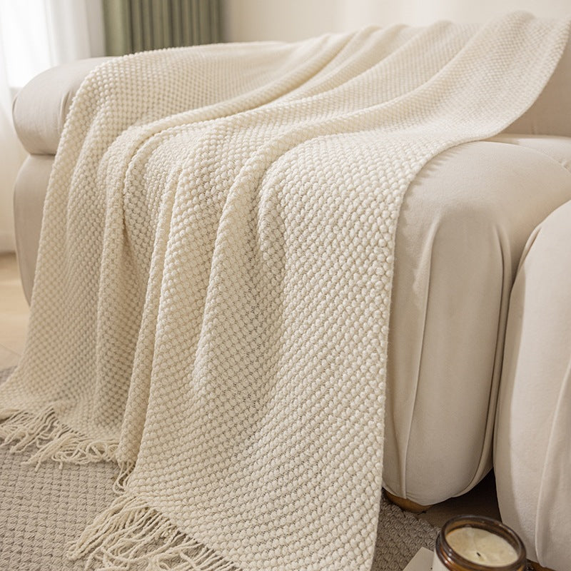 Cream textured knit throw blanket with tassels