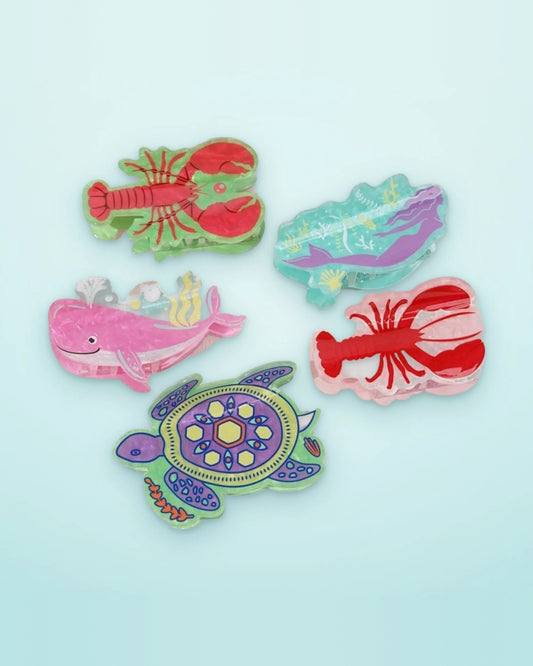 Ocean creatures acetate claw clips — lobsters, mermaid, whale and sea turtle on an aqua background