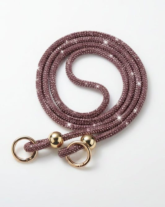 Pink beaded lanyard with gold metal clasps on a white background
