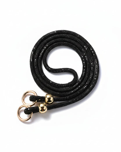 A clear mobile phone case with a luxury rhinestone lanyard attached to it, featuring a sparkling strap and rhinestone clasps.