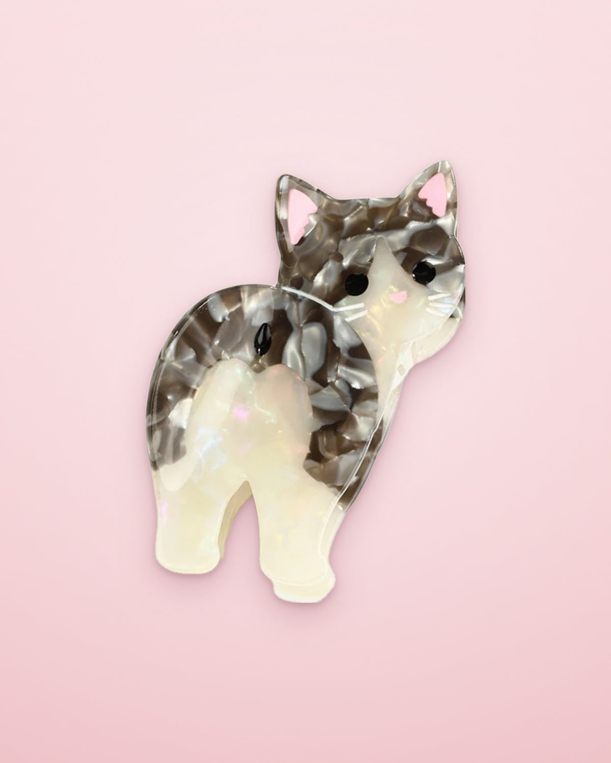 Glancing grey cat acetate claw clip on a blush pink background
