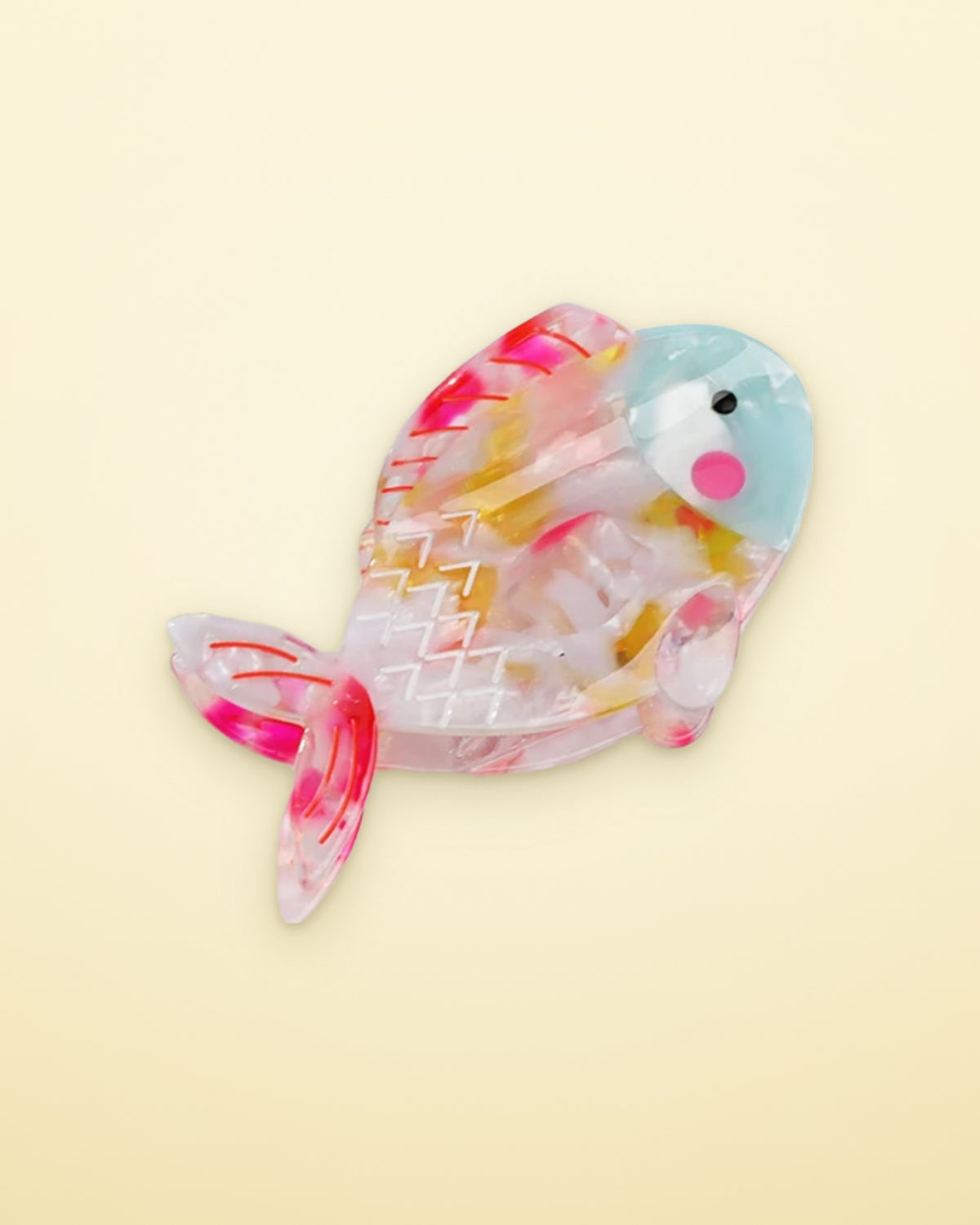 Confetti Fish acetate claw clip on a butter yellow background