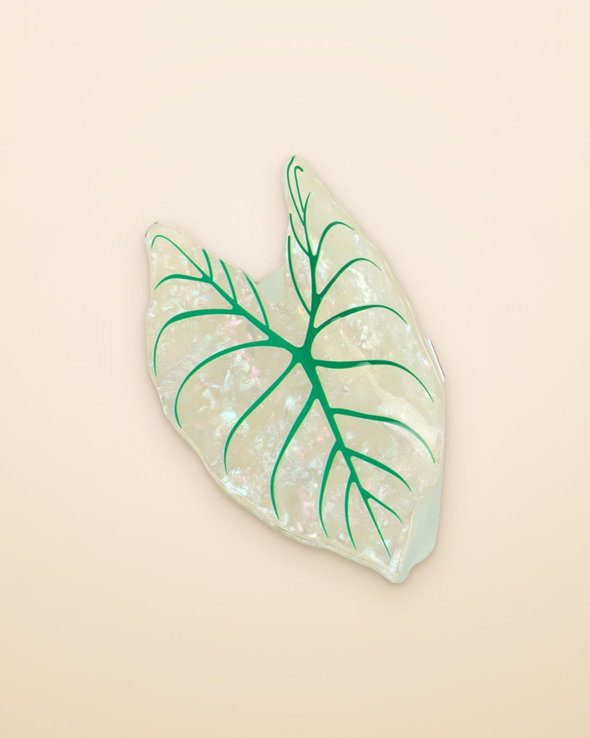 Moonlight Leaf claw clip on a sand background