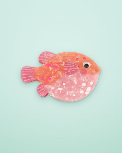 Coral Pufferfish acetate claw clip on a seafoam background