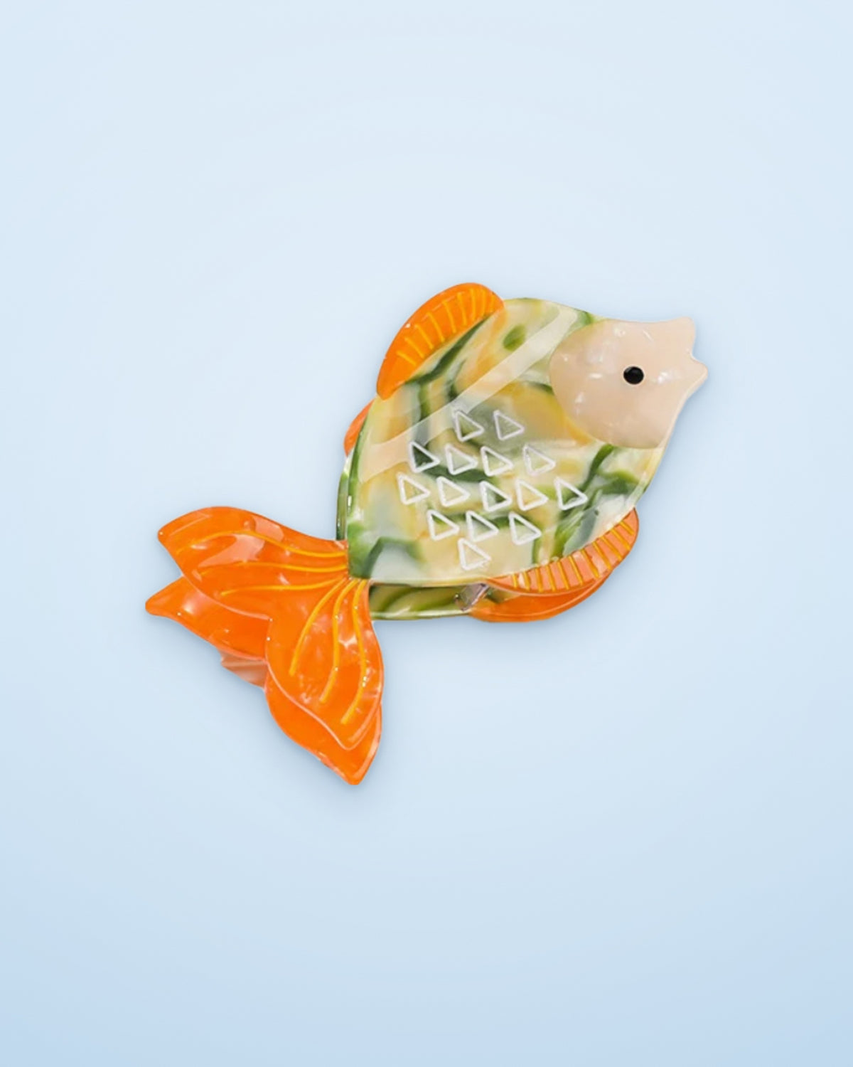 Orange Tail Fish acetate claw clip on a sky blue background