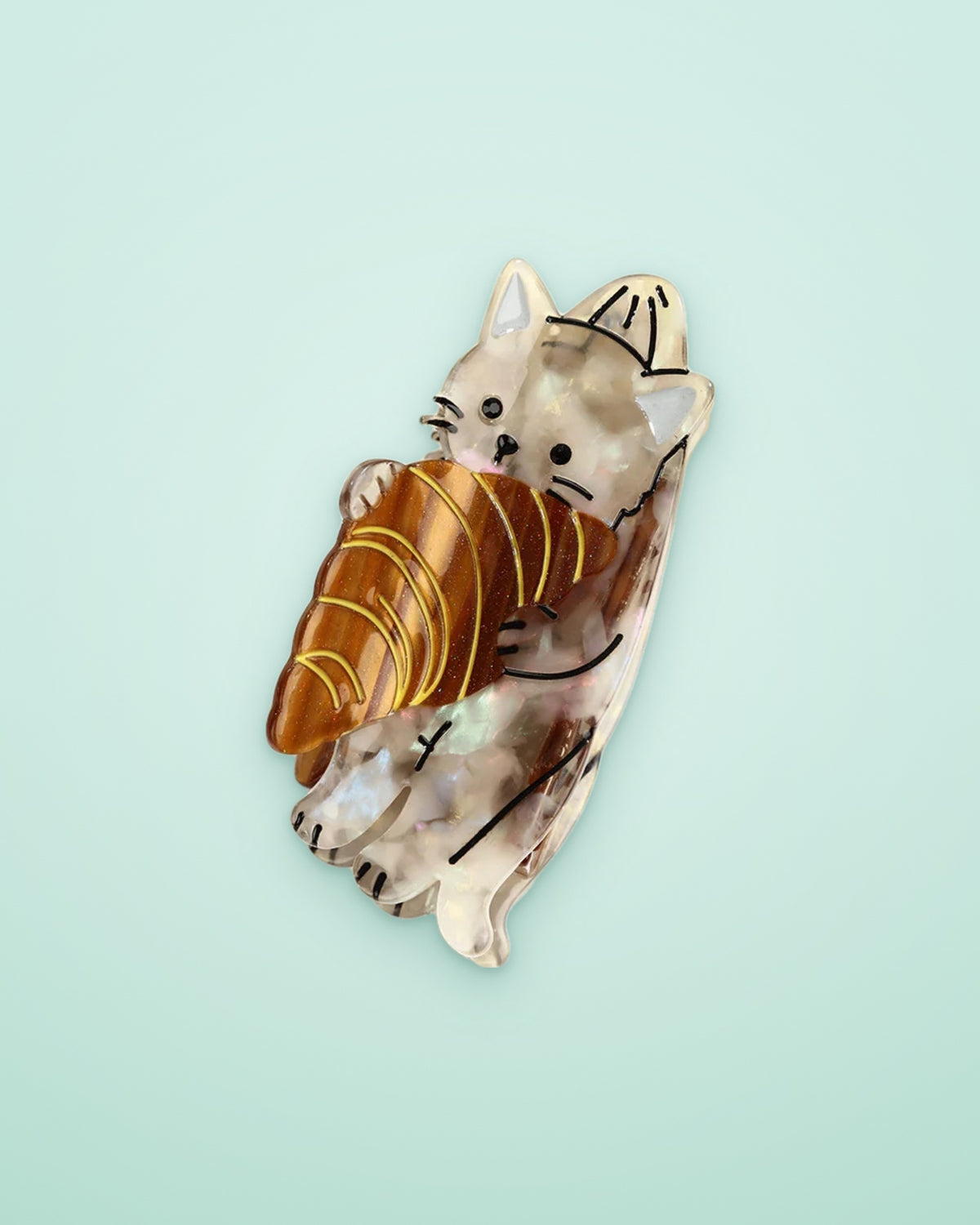 Croissant kitten acetate claw clip on a seafoam background