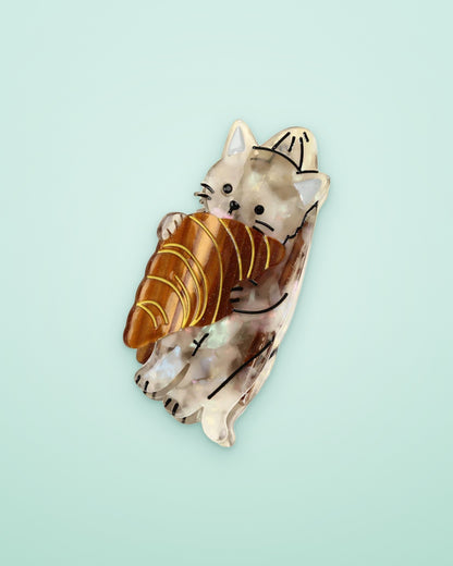 Croissant kitten acetate claw clip on a seafoam background
