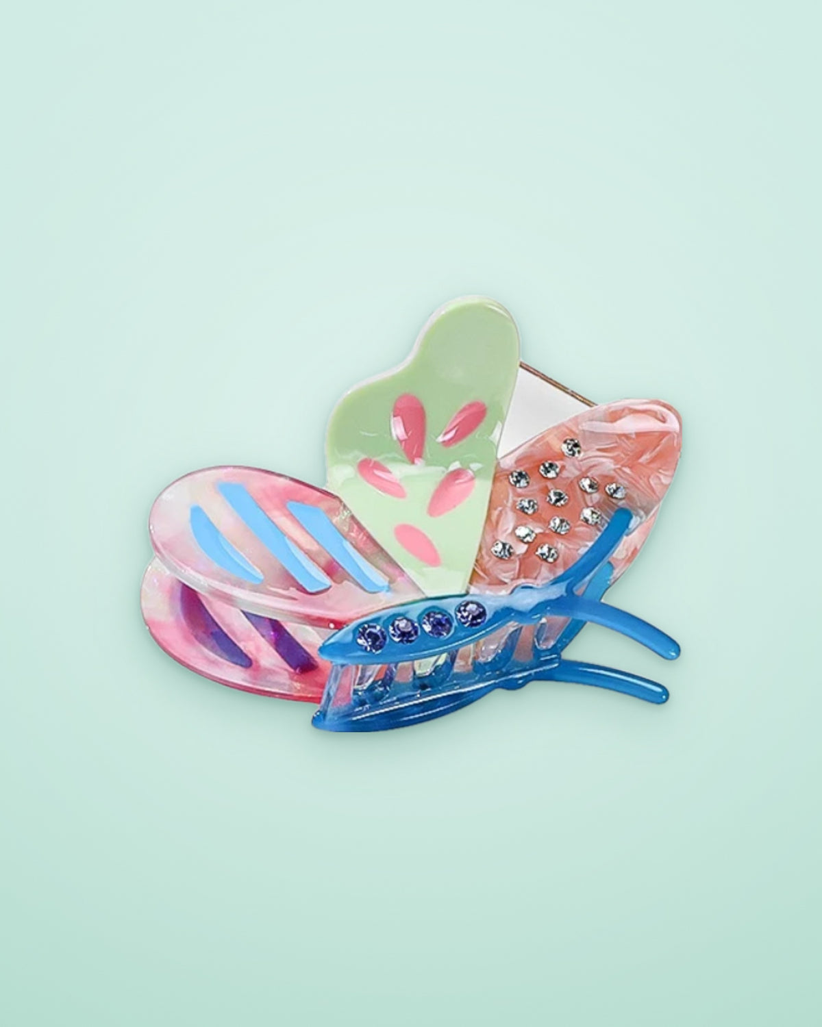 Lilac Meadow butterfly acetate claw clip on a seafoam background