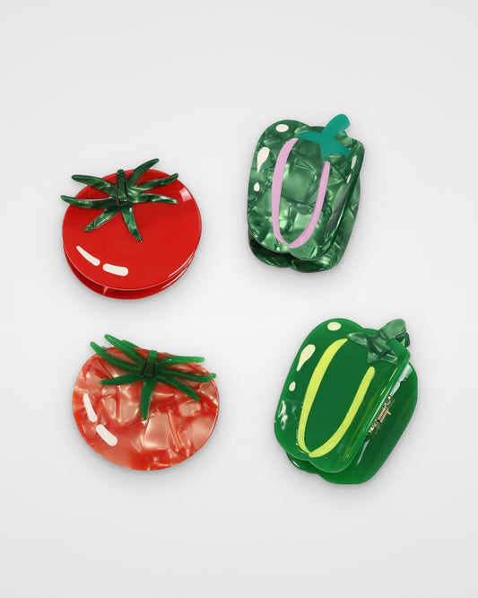 Tomato and green pepper acetate claw clips — all four designs on a light gray background