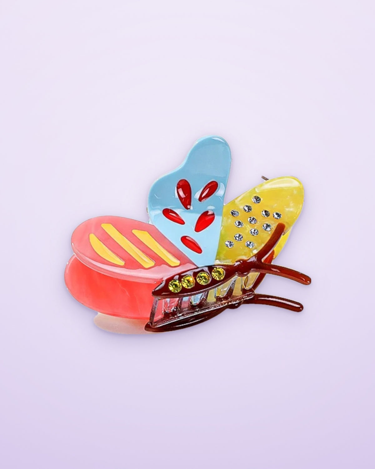 Tropical Sunset butterfly acetate claw clip on a lavender background