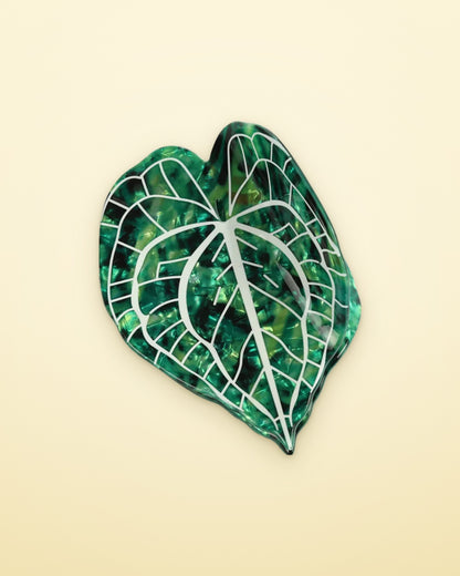 Midnight Velvet leaf claw clip on a butter yellow background