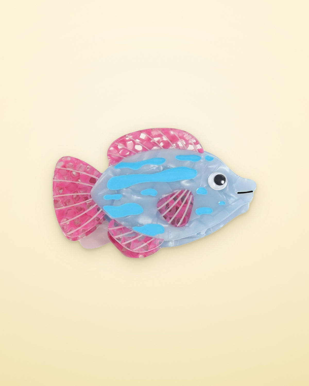 Blue Lagoon Fish acetate claw clip on a butter yellow background