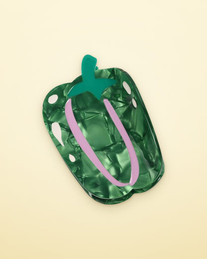 Marbled green pepper acetate claw clip on a butter yellow background