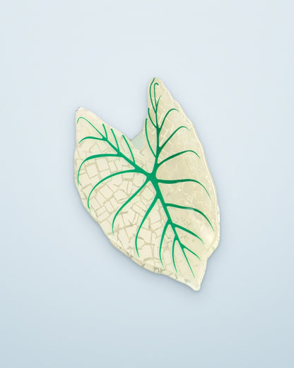 Ivory Lace leaf claw clip on a dusty blue background