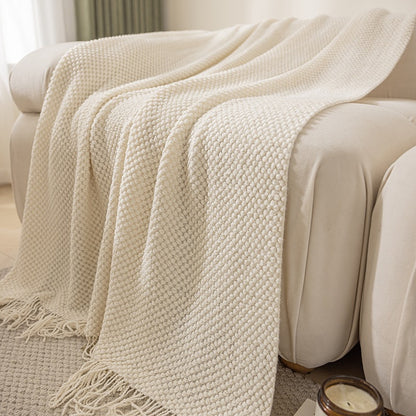 Cream textured knit throw blanket with tassels