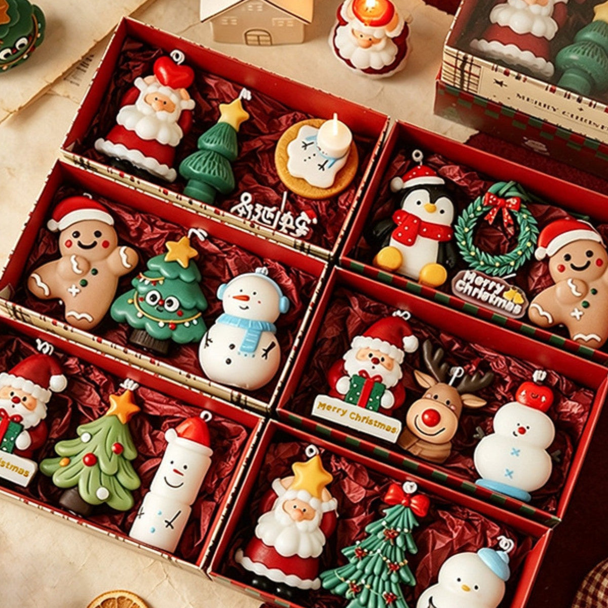 Six Christmas character candle gift boxes with Santa, snowman, penguin, reindeer and gingerbread candles