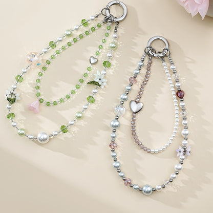 Two crystal bead phone wristlet chains laid flat