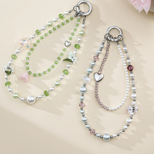 Two crystal bead phone wristlet chains laid flat