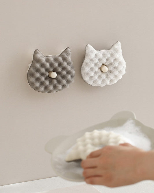 Grey and white cat sponges wall-mounted on suction bases