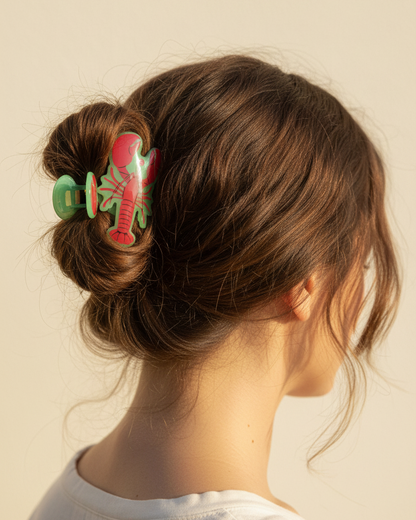 Green-edged lobster claw hair clip worn in a casual bun