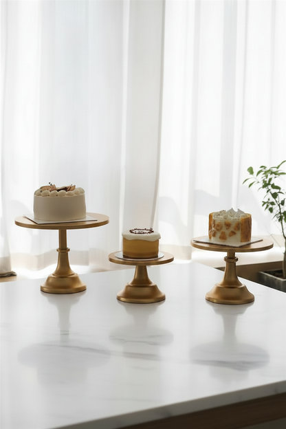 Gold Nordic cake stands lifestyle hero shot with cakes on marble