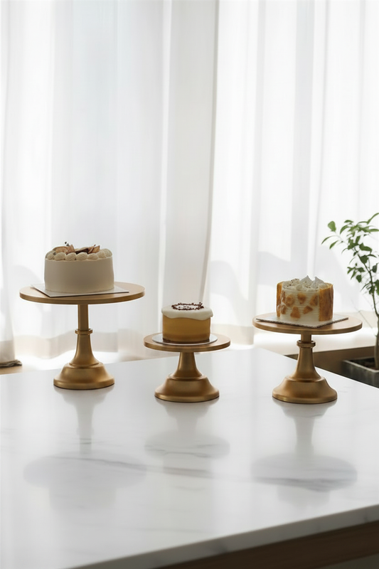 Gold Nordic cake stands lifestyle hero shot with cakes on marble