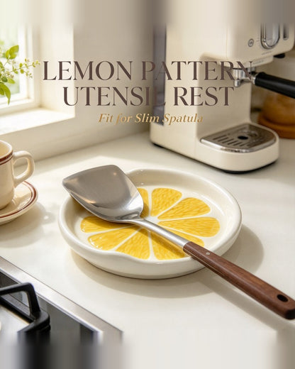 Lemon pattern utensil rest beside coffee machine with spatula