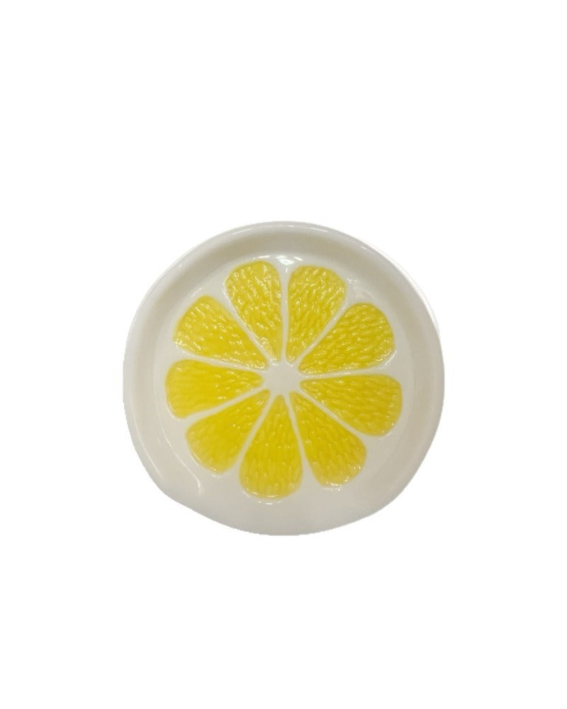 Top view of embossed lemon slice ceramic spoon rest
