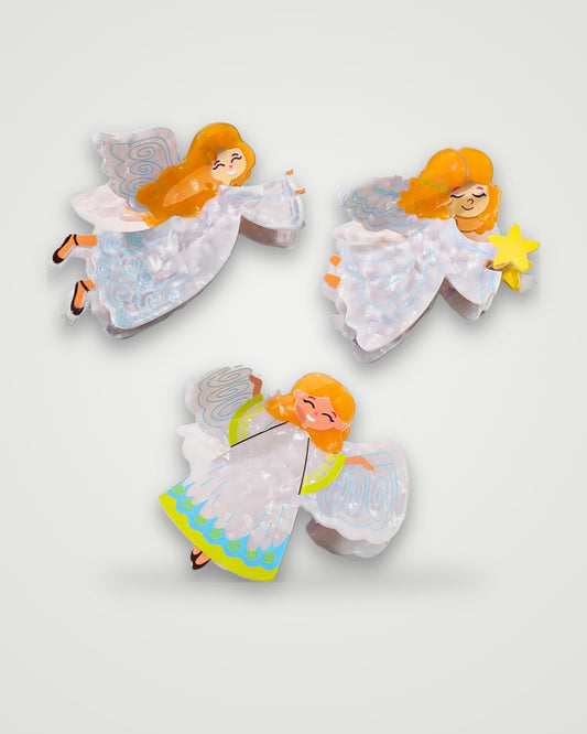 Little angel acetate claw clips in Soaring Seraph, Starry Dreamer and Sunny Halo on a light gray backdrop