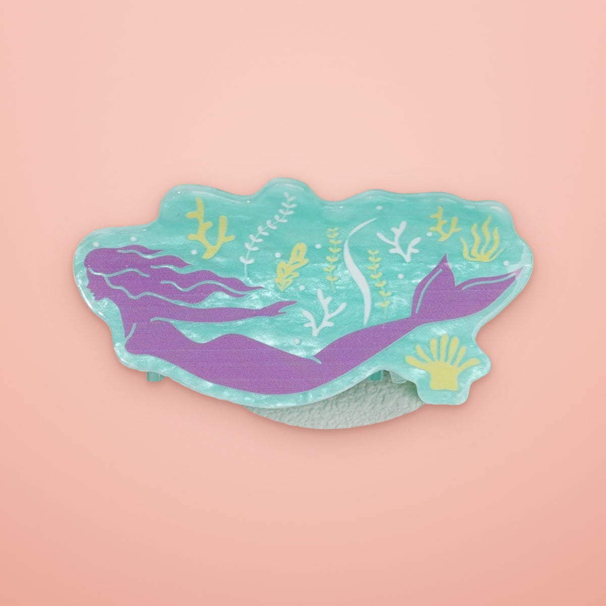 Mermaid acetate claw clip on a coral background