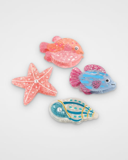 Reef life acetate claw clips — Coral Pufferfish, Pearl Starfish, Blue Lagoon Fish and Seafoam Conch on a light gray background