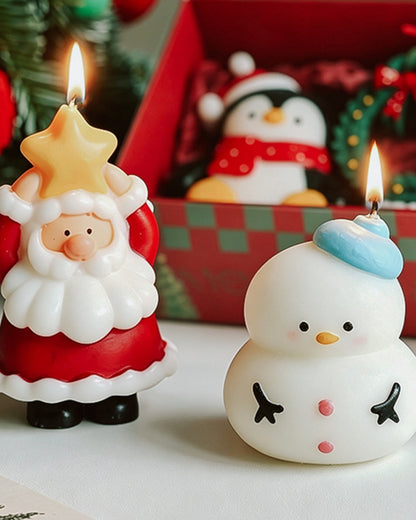 Lit Santa and snowman Christmas candles