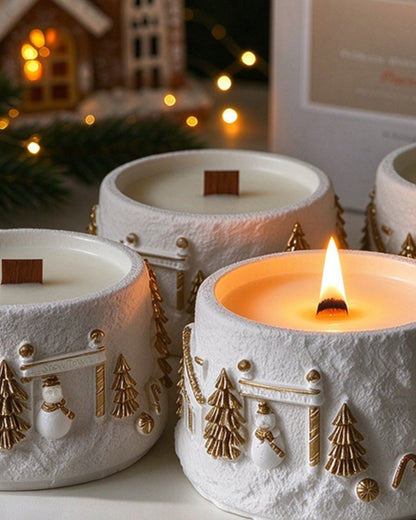 Group of Snow Village Christmas candles glowing in a cosy holiday setting